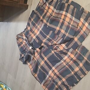 A2. Clasped over shoulder covering